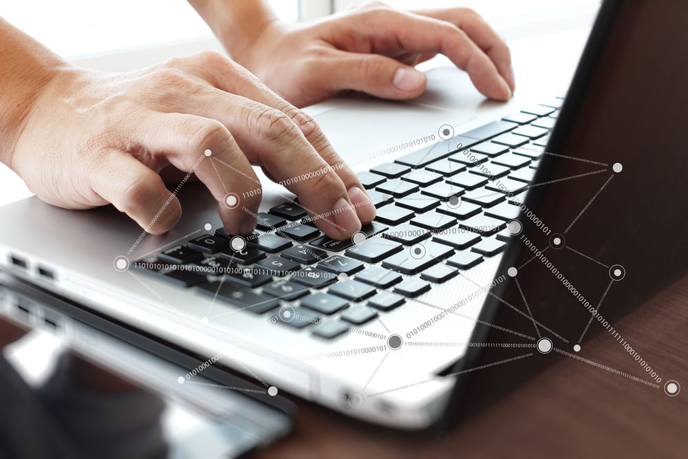 Close up of business man hand working on laptop computer with social network diagram on wooden desk as concept-2