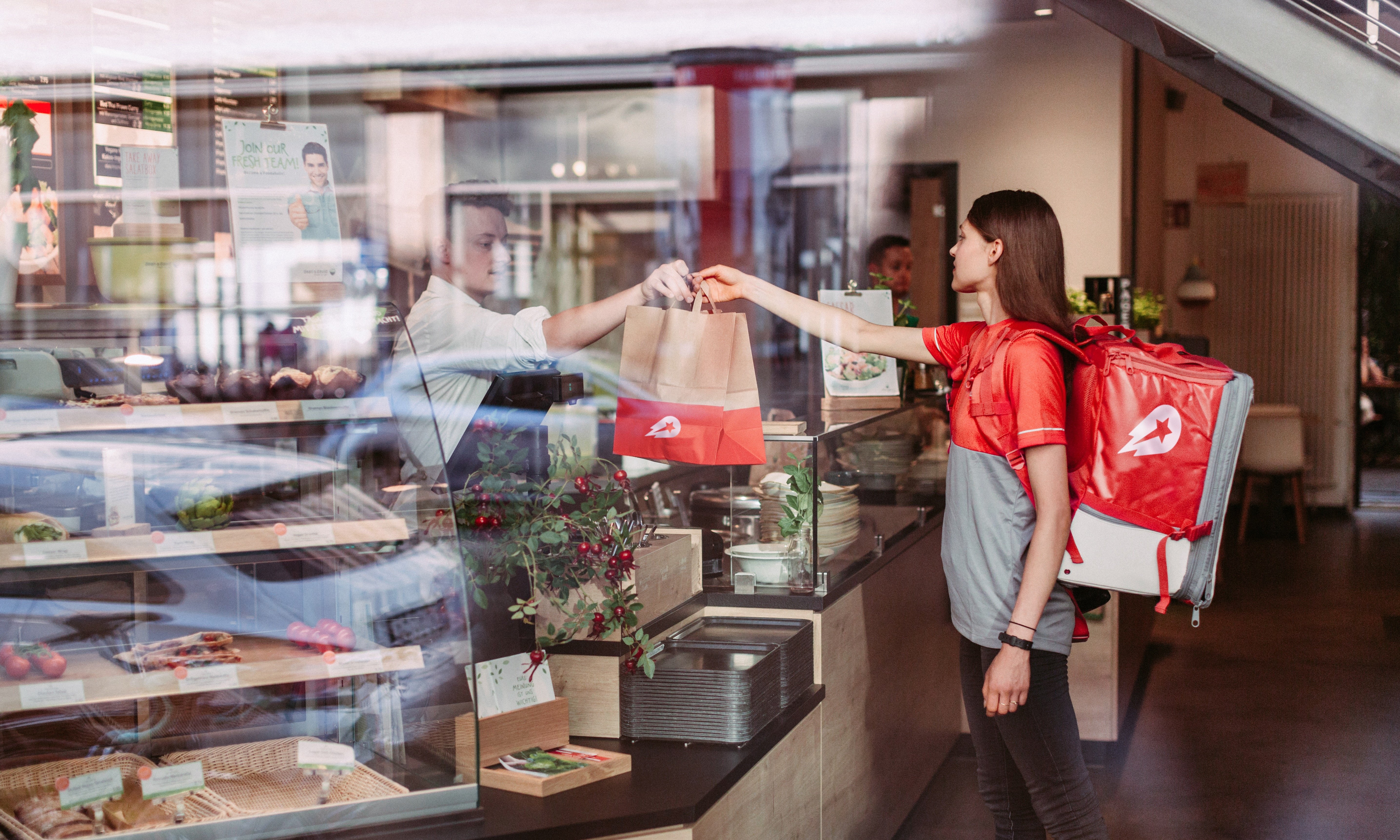 Food delivery worker receiving order.