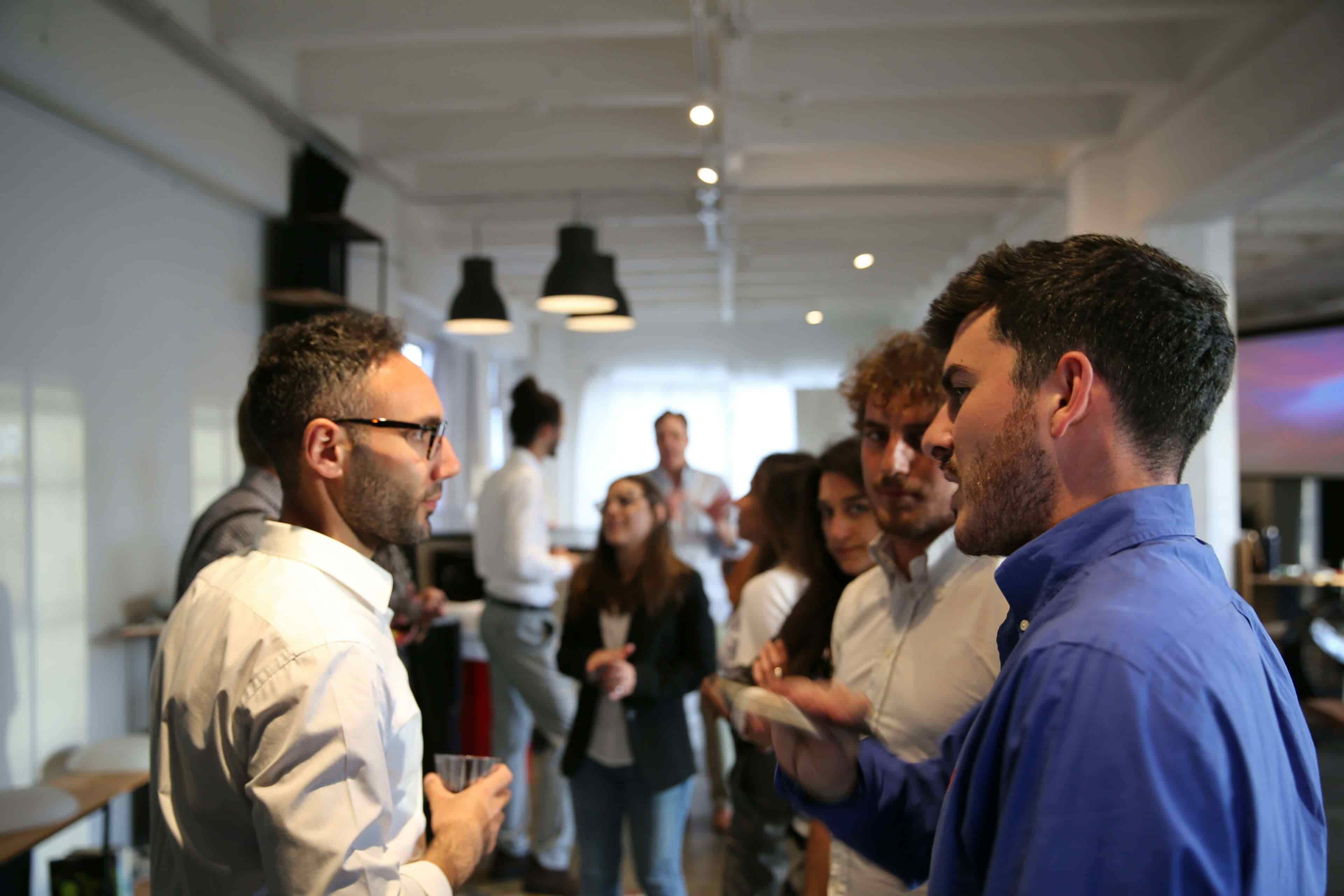 group of business professionals networking at an event